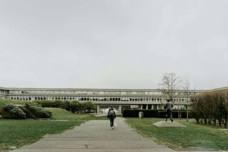 a girl is going to a building