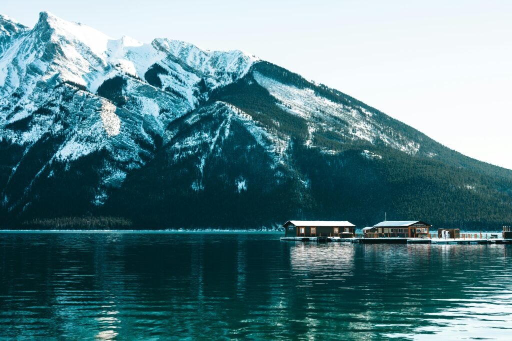 Stunning snow-capped mountains and tranquil lake scene in Banff, Canada.