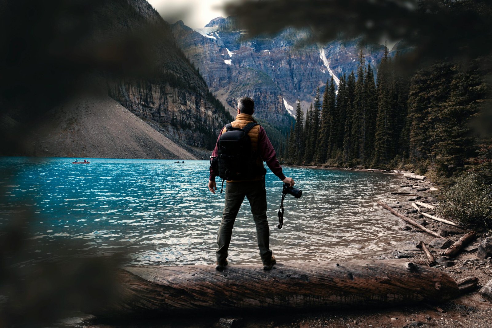 Photographer at Moraine Lake in Banff National Park, Canada, capturing the scenic beauty.